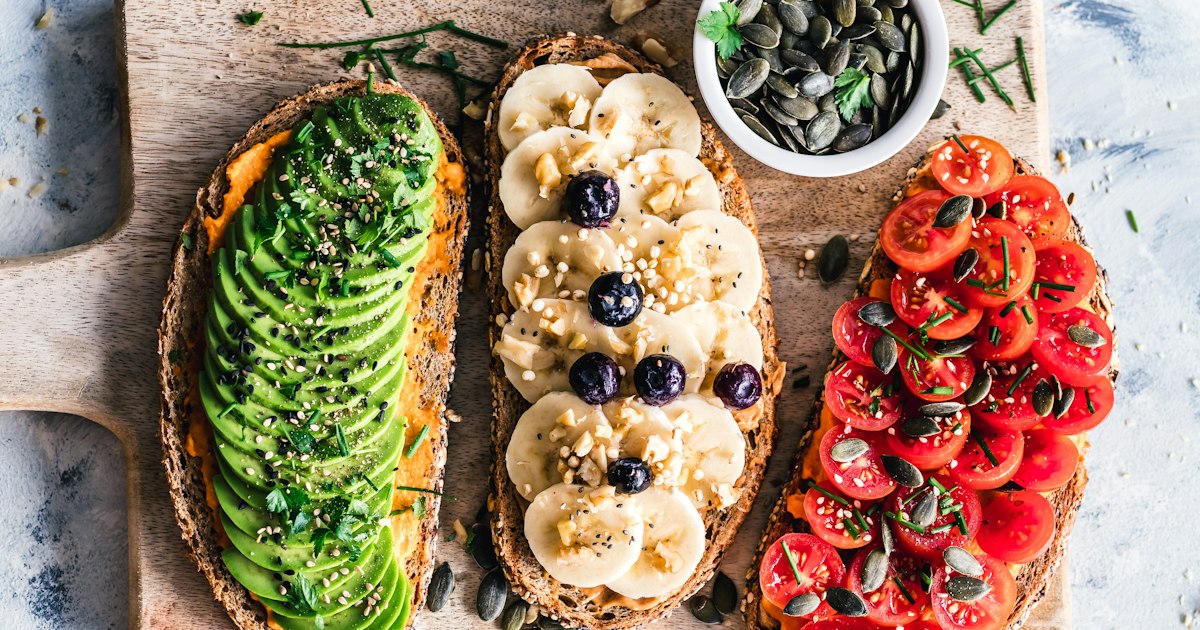 Traditional Lebanese breakfast spread with flatbread, labneh, olives and fresh vegetables on a table